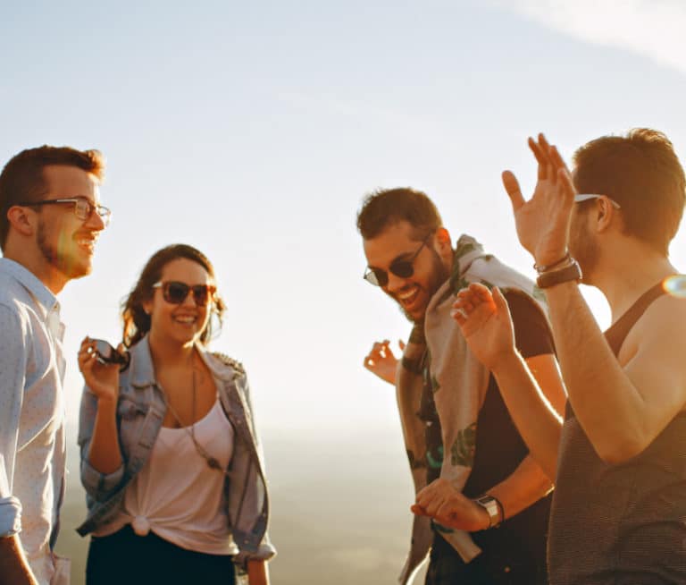 group of friends during golden hour smiling